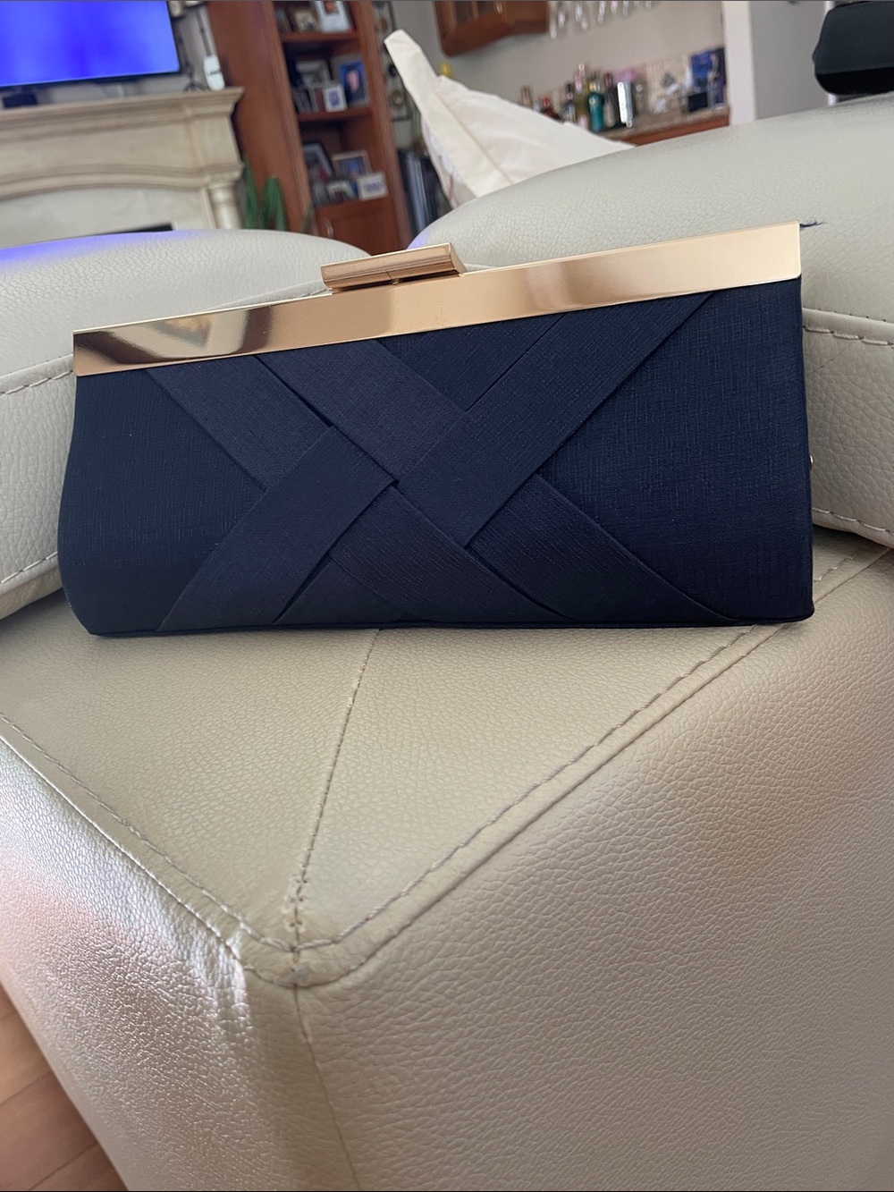 Navy Blue Evening Clutch with Gold Frame. Has coordinating strap